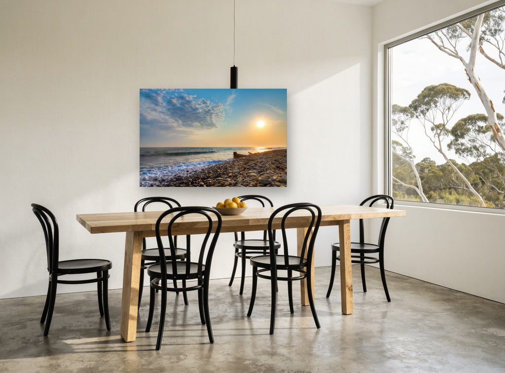 Pebble Shore Sunset coastal canvas print on the wall of a dining room
