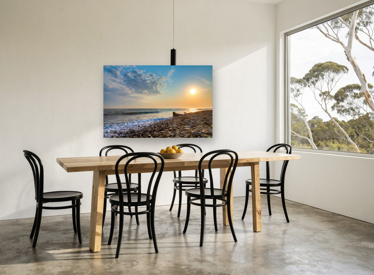 Pebble Shore Sunset coastal canvas print on the wall of a dining room