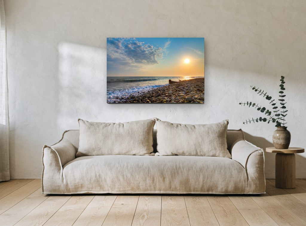 Pebble Shore Sunset coastal canvas print on the wall of a living room