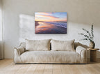 Sunrise Shoreline Glow coastal canvas print on the wall of a living room