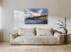 Pier at Dusk Drama coastal canvas print on the wall of a living room