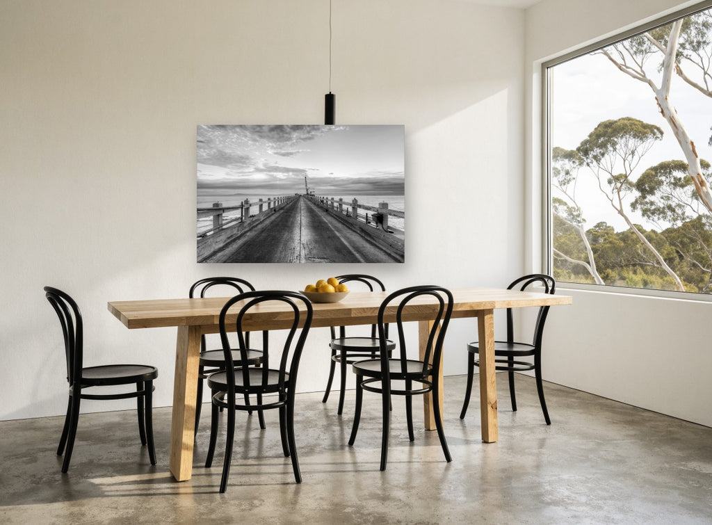 Pier Toward the Crane coastal canvas print on the wall of a dining room