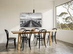 Pier Toward the Crane coastal canvas print on the wall of a dining room
