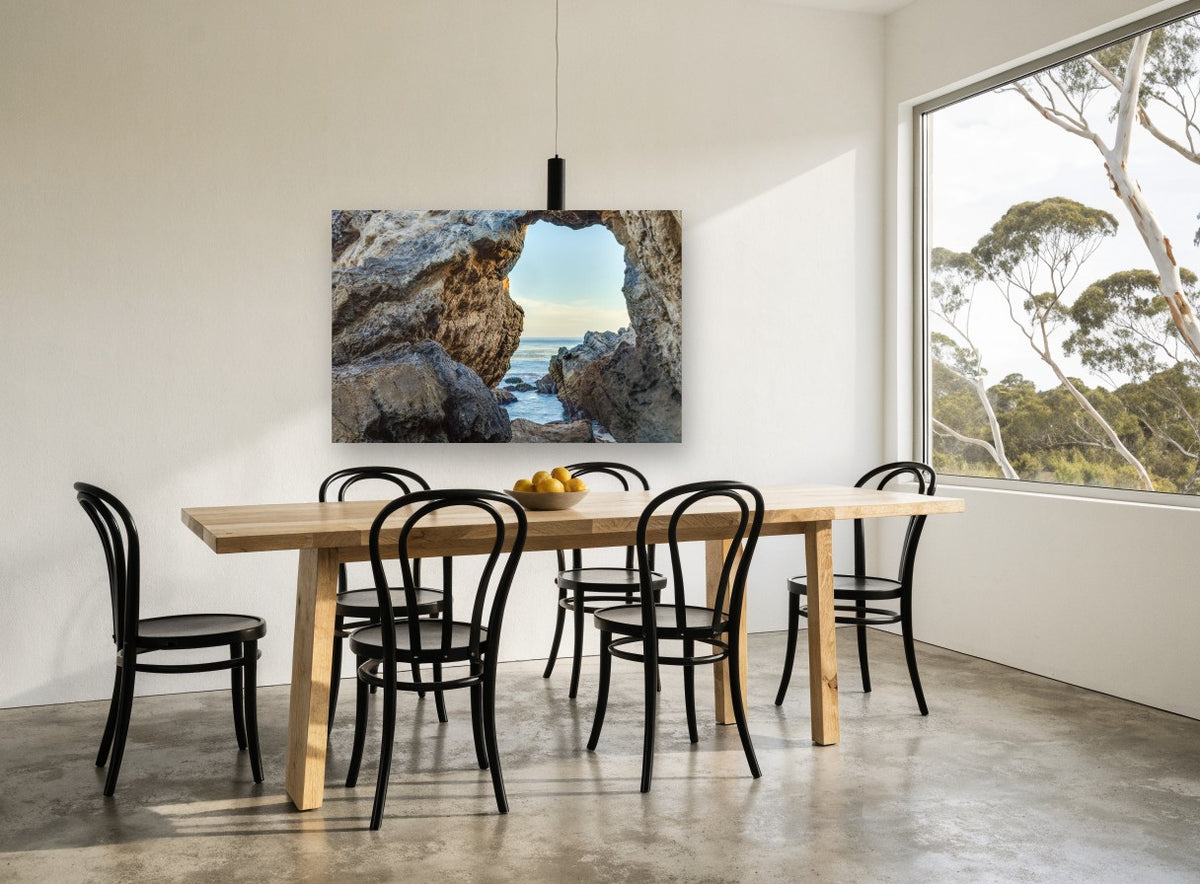 Window to the Sea coastal canvas print on the wall of a dining room