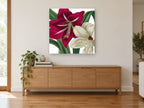 Crimson and Cream Amaryllis floral canvas print on the wall of a living room above a sideboard