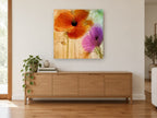 Orange and Violet Poppies floral canvas print on the wall of a living room above a sideboard
