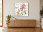 Sweet Pea Harlequin floral canvas print on the wall of a living room above a sideboard