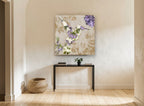 Lilac Tapestry Hummingbird floral canvas print on the wall of a hallway