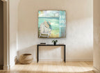 Hat on the Beach Chair coastal canvas print on the wall of a hallway