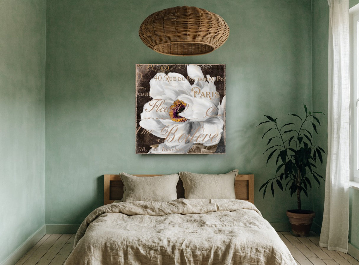 White Bloom Paris Script floral canvas print on the wall of a bedroom