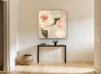 Blush Rose and Perfume floral canvas print on the wall of a hallway