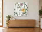 Meadow Bell and Daisy floral canvas print on the wall of a living room above a sideboard