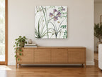 Lilac Gladioli Meadow floral canvas print on the wall of a living room above a sideboard