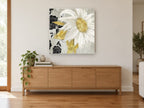 White Daisy Silhouettes floral canvas print on the wall of a living room above a sideboard