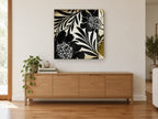 Midnight Leaf Silhouettes floral canvas print on the wall of a living room above a sideboard