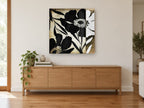 Black Poppy Silhouettes floral canvas print on the wall of a living room above a sideboard