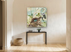 Robin's Nest Collage floral canvas print on the wall of a hallway
