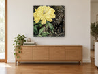 Yellow Peony Noir floral canvas print on the wall of a living room above a sideboard