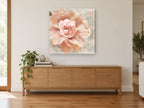 Blush Rose Bloom floral canvas print on the wall of a living room above a sideboard