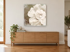 Ivory Bloom Impasto floral canvas print on the wall of a living room above a sideboard