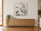 Oregano in Bloom floral canvas print on the wall of a living room above a sideboard