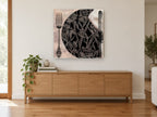 Botanical Place Setting vintage canvas print on the wall of a living room above a sideboard