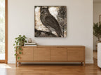 Etched Horned Owl animal canvas print on the wall of a living room above a sideboard