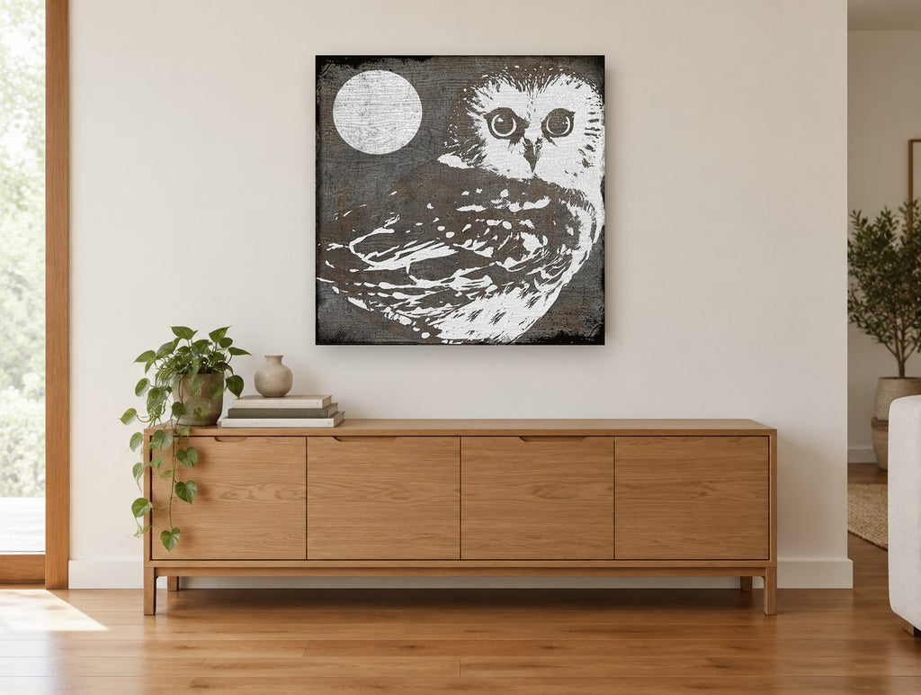 Moonlit Woodgrain Owl animal canvas print on the wall of a living room above a sideboard