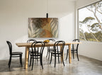 Rust Peony Silhouettes floral canvas print on the wall of a dining room