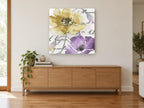 Gold and Violet Poppies floral canvas print on the wall of a living room above a sideboard