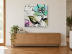 Bonjour Blossom Script floral canvas print on the wall of a living room above a sideboard