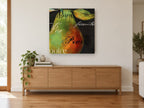Pear in Many Tongues kitchen canvas print on the wall of a living room above a sideboard