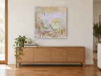 Pearl Nautilus Damask coastal canvas print on the wall of a living room above a sideboard