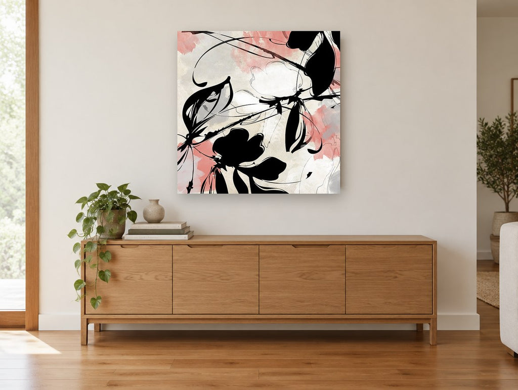 Coral Ink Blooms floral canvas print on the wall of a living room above a sideboard