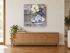 Peony Pitcher and Dragonfly floral canvas print on the wall of a living room above a sideboard