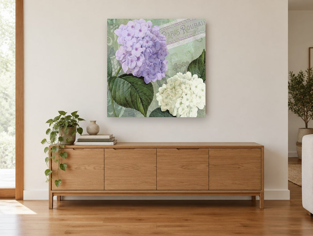 Lilac and White Hydrangeas floral canvas print on the wall of a living room above a sideboard