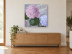Lilac Hydrangea Postcard floral canvas print on the wall of a living room above a sideboard