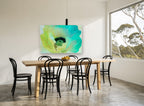 Aqua Poppy Bloom floral canvas print on the wall of a dining room