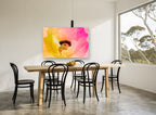 Sunrise Poppy Bloom floral canvas print on the wall of a dining room