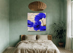 Cobalt Poppies on Script floral canvas print on the wall of a bedroom