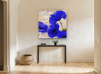 Cobalt Poppies on Script floral canvas print on the wall of a hallway