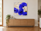 Cobalt Poppies on Script floral canvas print on the wall of a living room above a sideboard