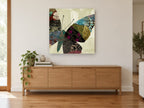 Patchwork Butterfly Wing floral canvas print on the wall of a living room above a sideboard
