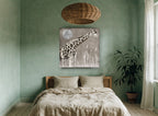 Giraffe Under Silver Moon animal canvas print on the wall of a bedroom