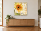 Sunflower Paris Script floral canvas print on the wall of a living room above a sideboard