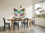 Teal Papillon Monarque animal canvas print on the wall of a dining room
