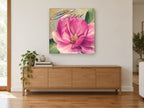 Pink Magnolia Paris floral canvas print on the wall of a living room above a sideboard