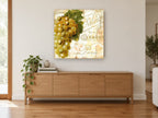 Golden Grapes Paris Script kitchen canvas print on the wall of a living room above a sideboard