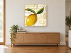 Parisian Lemon Script kitchen canvas print on the wall of a living room above a sideboard