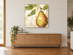 Golden Pear Paris kitchen canvas print on the wall of a living room above a sideboard